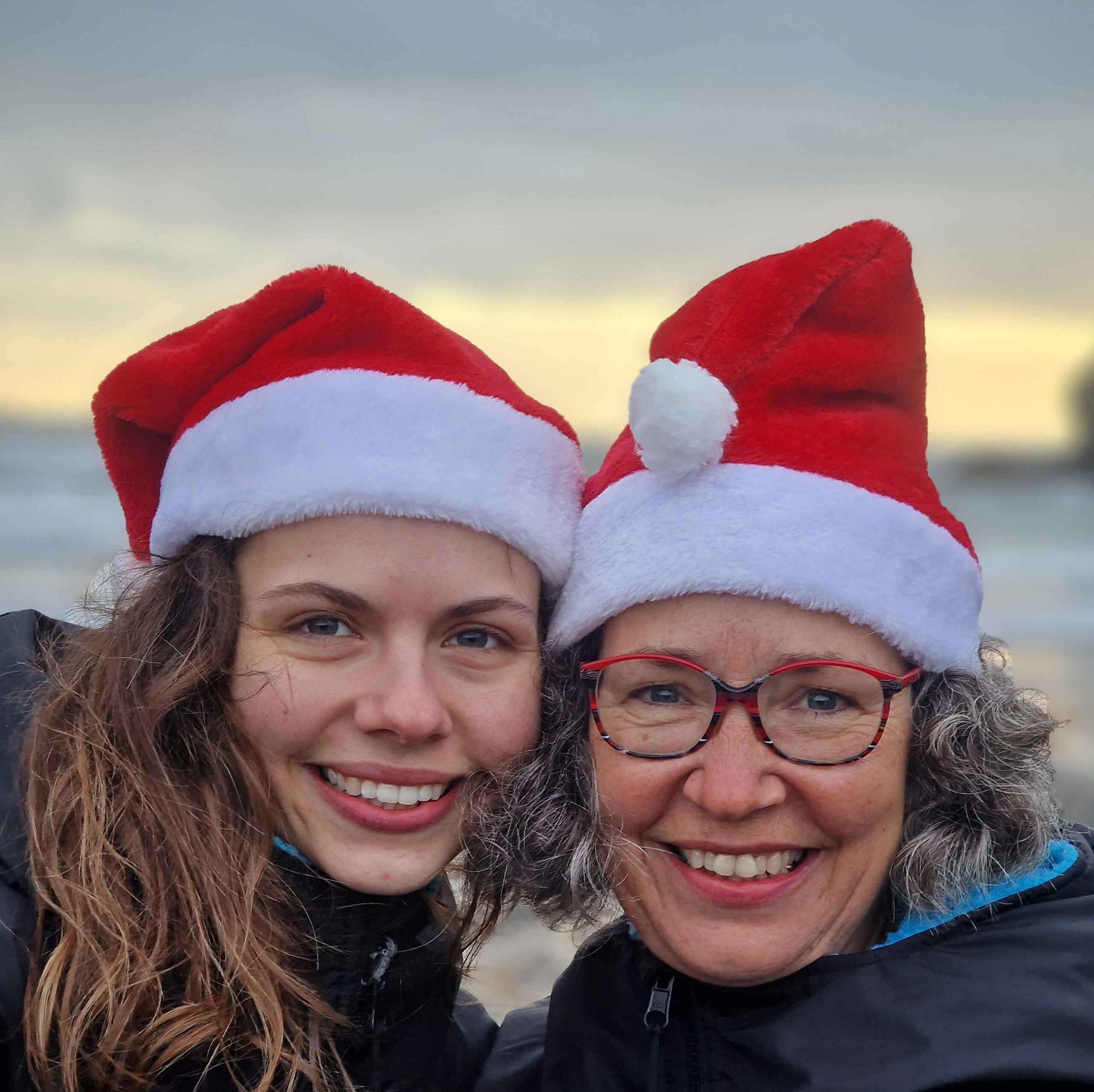 Swimmers in Santa hats